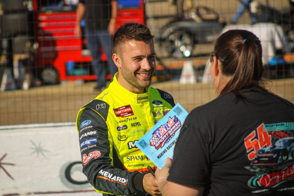 Race fans at the track with Racetoons coloring books